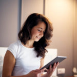 Woman researching LASIK on a tablet