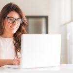 Woman with glasses researching LASIK