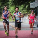 Three people running in a race