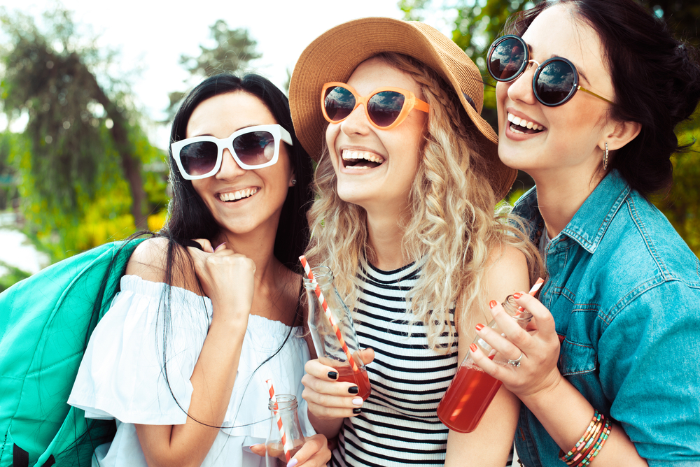 3 women wearing sunglasses.
