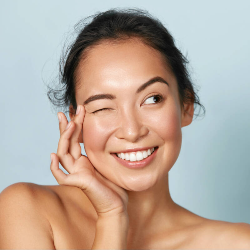 Youthful Asian Woman with glowing skin at Pacific Eye Associates